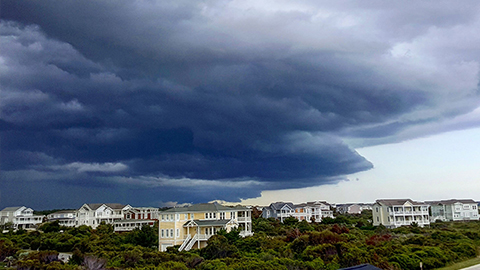 Large shelf cloud advancing over homes at Holden Beach, North Carolina