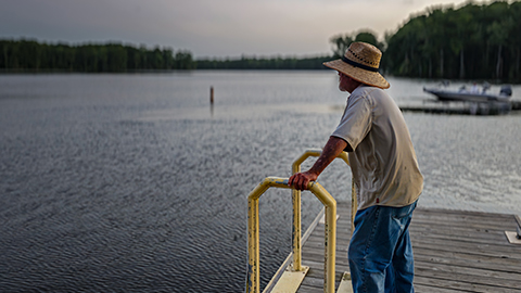 Chuck Copeland's father looking across the Cashie River from a wooden dock